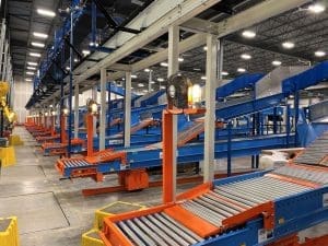 Multiple drive out conveyors